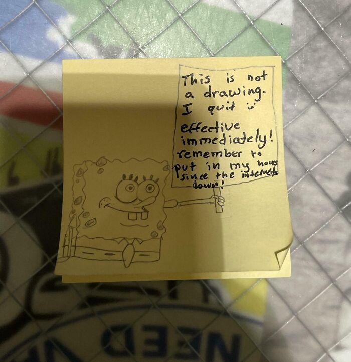 Sticky note with a drawn character, announcing job resignation humorously.