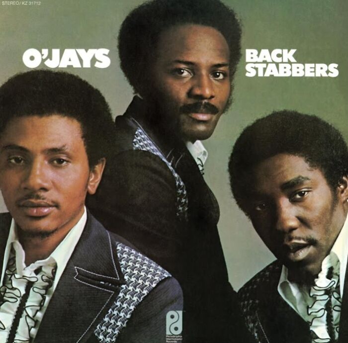 '70s band the O'Jays, album cover "Back Stabbers," featuring three members wearing retro suits.