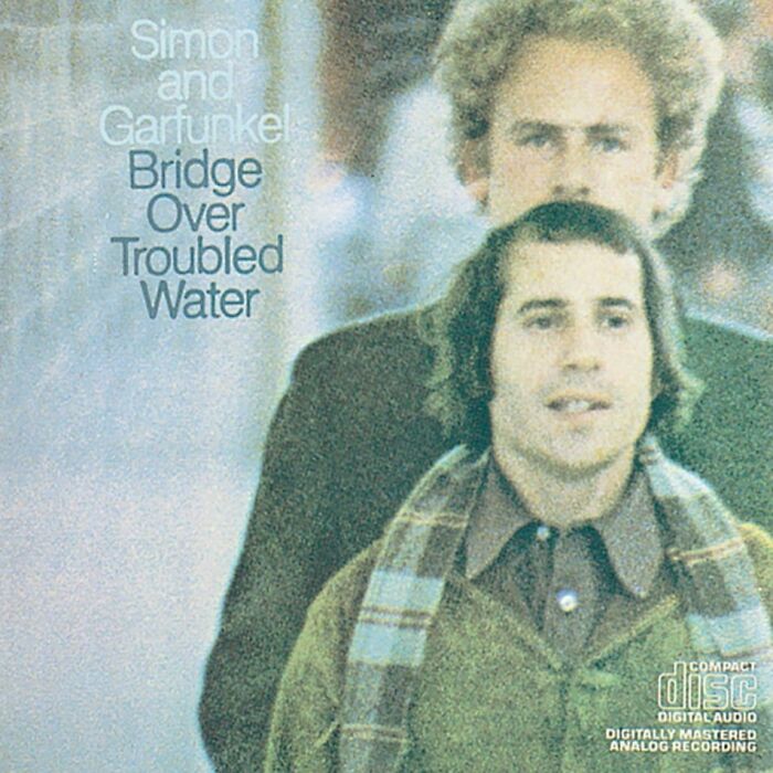 Album cover of Simon and Garfunkel's "Bridge Over Troubled Water," a classic '70s song.