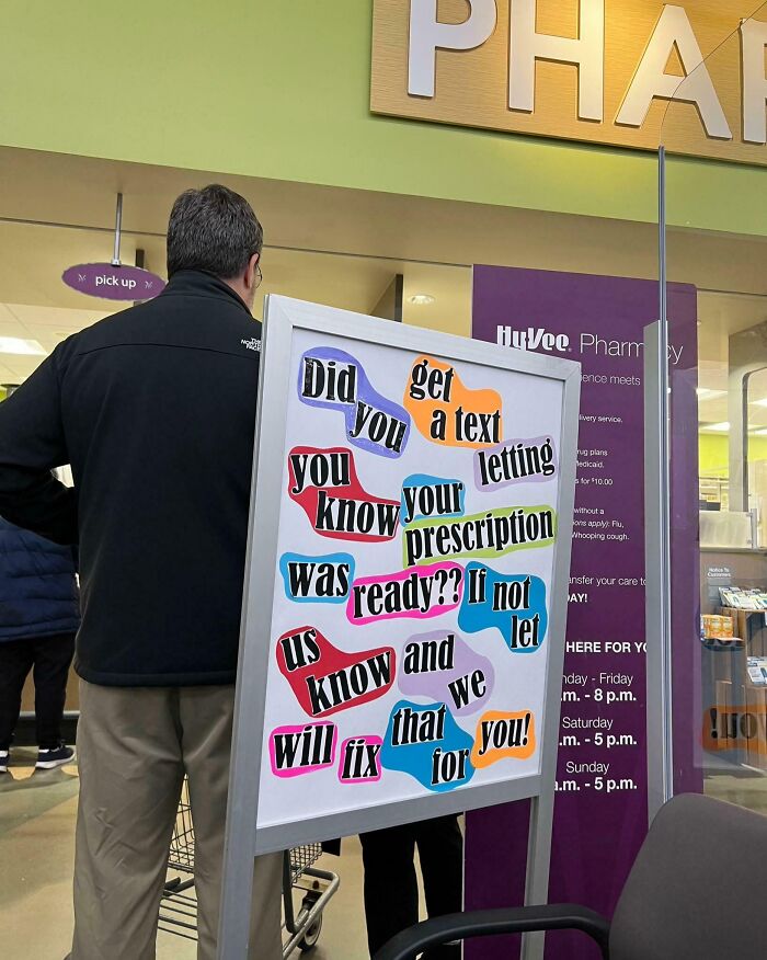 Sign at local pharmacy with colorful text asking if customers received a prescription notification.