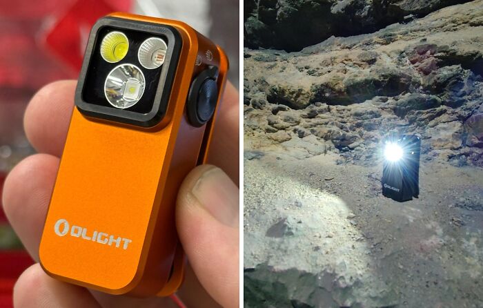 Compact orange flashlight from new Amazon releases, held in hand and illuminating rocky terrain.