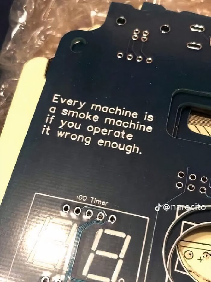 Circuit board with text: "Every machine is a smoke machine if you operate it wrong enough." Science meme humor.