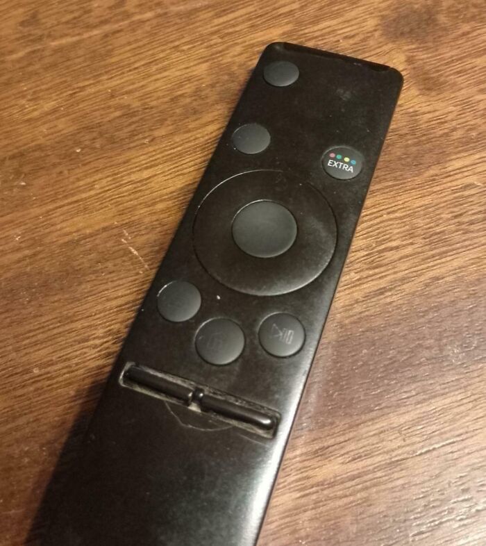 Worn-down TV remote with faded buttons illustrating how time affects objects.