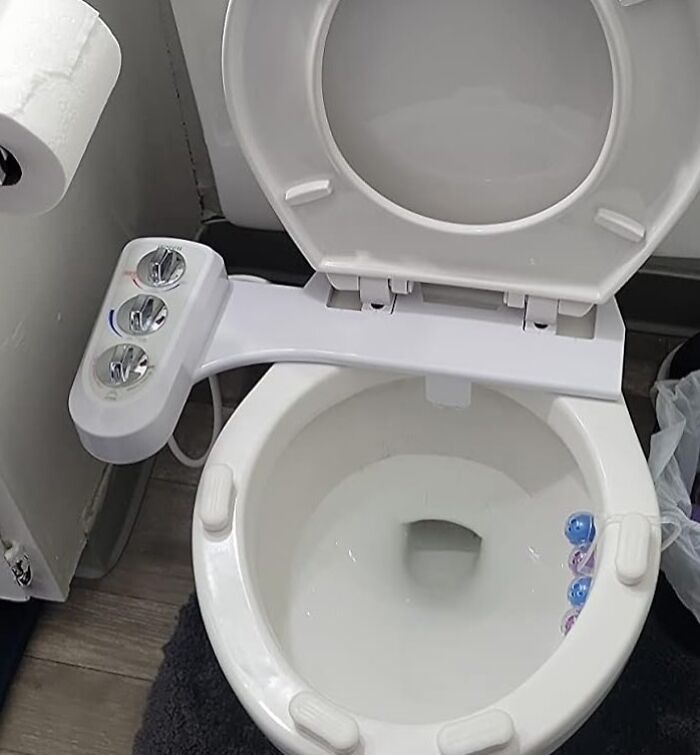 Modern toilet with bidet attachment, showcasing one of the hottest new Amazon releases.