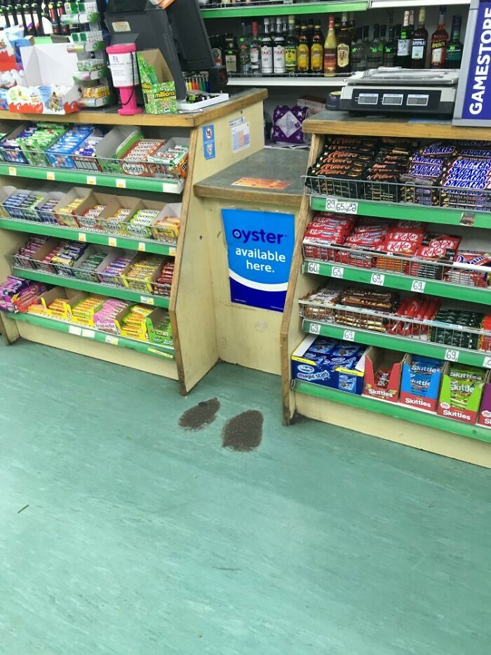 Worn-down floor spot in a convenience store shows how time affects surfaces.