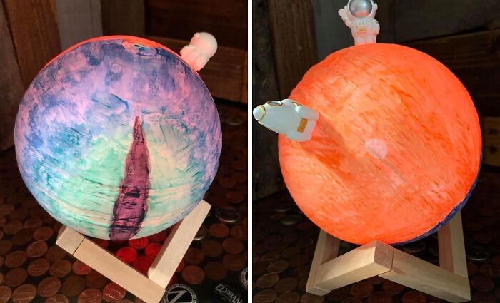 Colorful artistic globe with astronaut figures on wooden stands, perfect for creative treasures exploration.