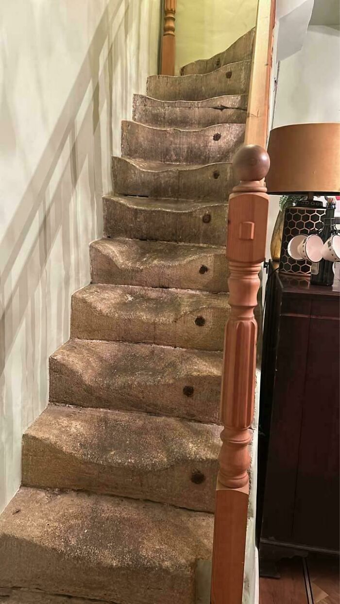 Worn-down stone stairs show the effects of time and frequent use, illustrating how time works through gradual erosion.