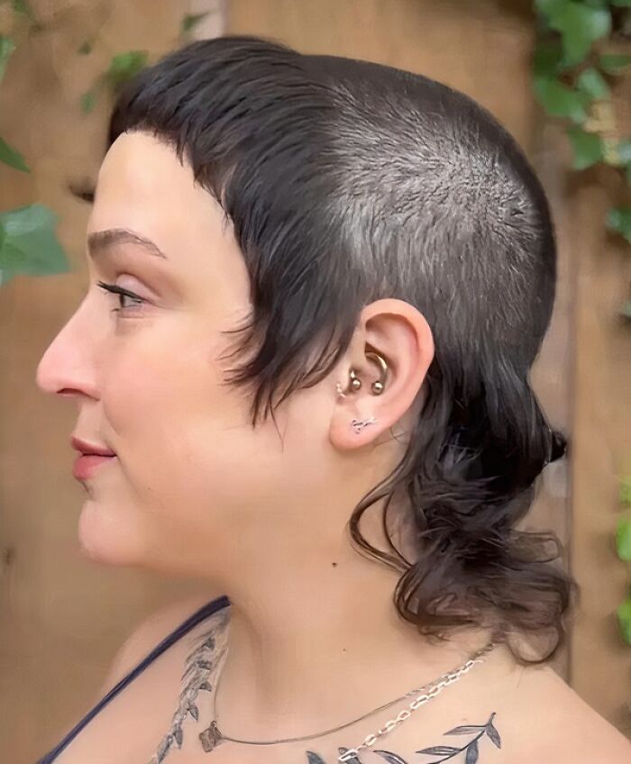 Close-up of a unique hairstyle with shaved sides and short bangs, illustrating a hair accident.