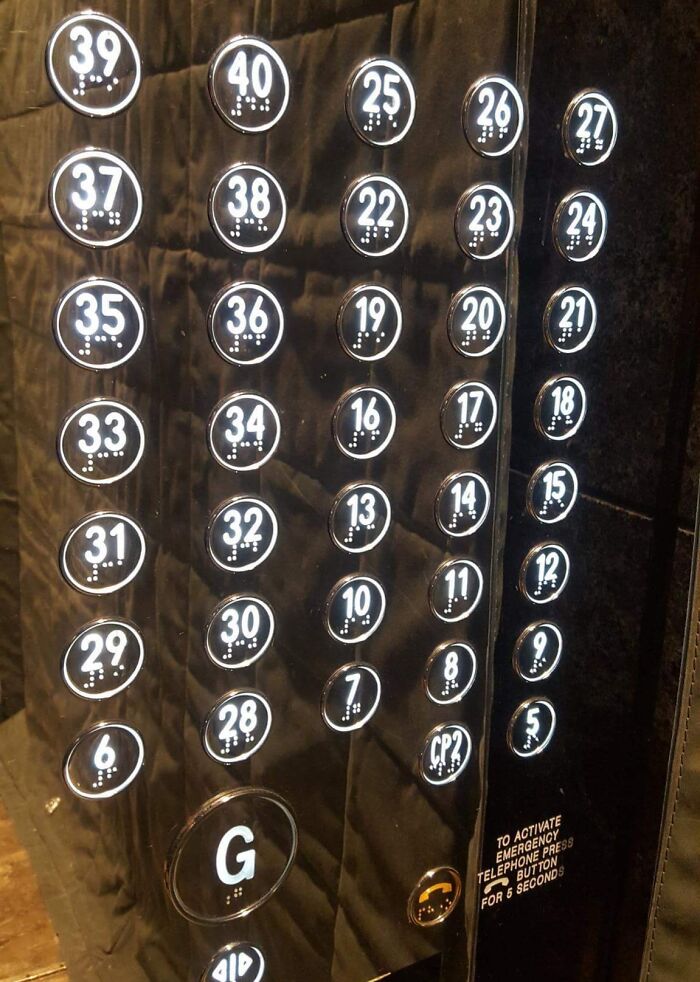 Elevator button panel with random floor numbers displaying unfortunate public interior design.