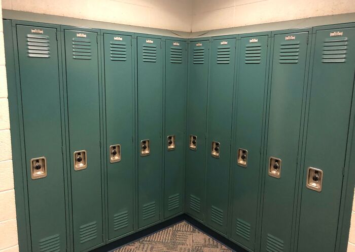 Unfortunate interior design with lockers positioned at a right angle, creating an inaccessible corner.