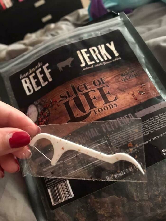 Pack of beef jerky with hidden floss pick surprise, showcasing cool product feature.