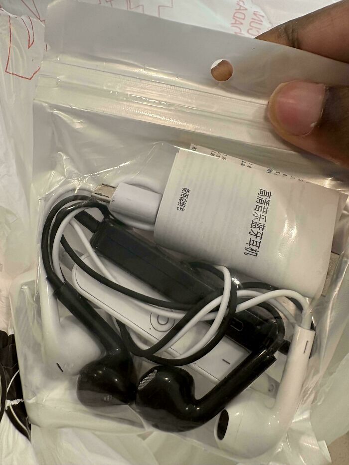 Bag of cool products with surprises, containing various earbuds and cables.