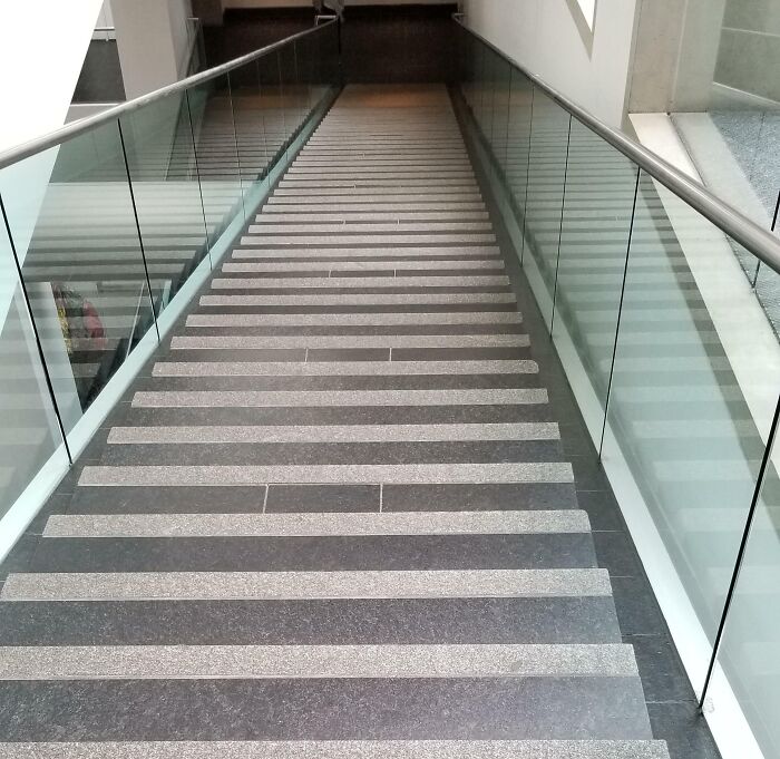 Staircase with irregular striped steps, an example of unfortunate public interior design.