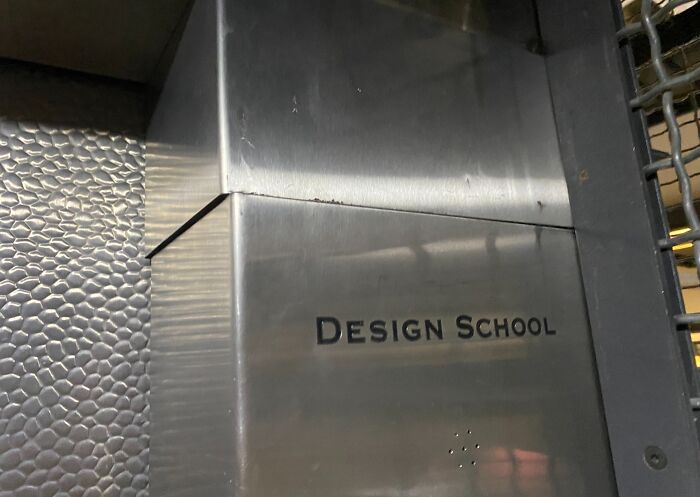 Metallic box labeled "Design School" showcasing unfortunate interior design.