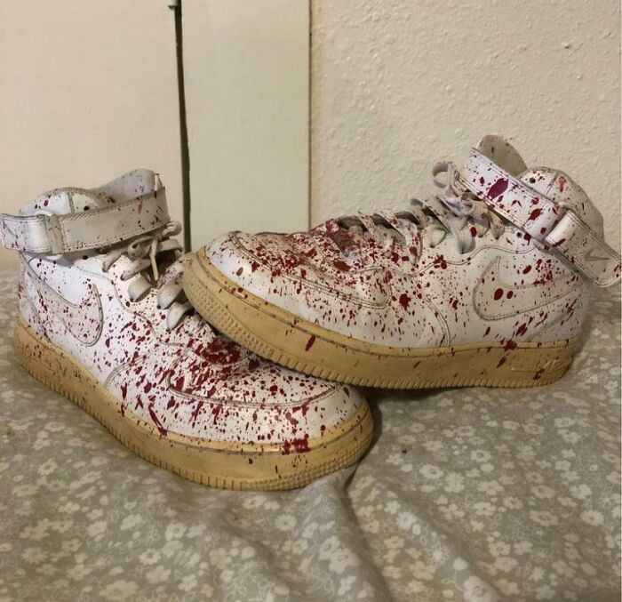 White sneakers splattered with red, embodying creepy things sold online.