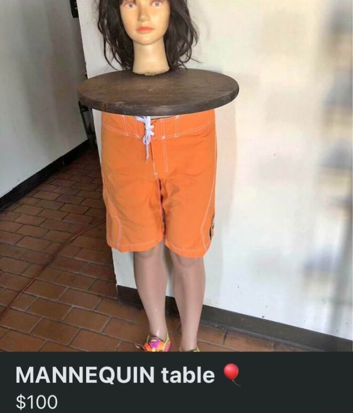 Mannequin table with human head and orange shorts, listed for sale online as a creepy item.