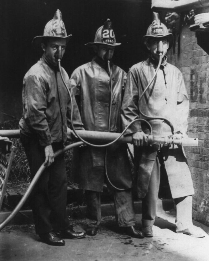 Firefighters with old breathing equipment, representing historical inventions ahead of their time.