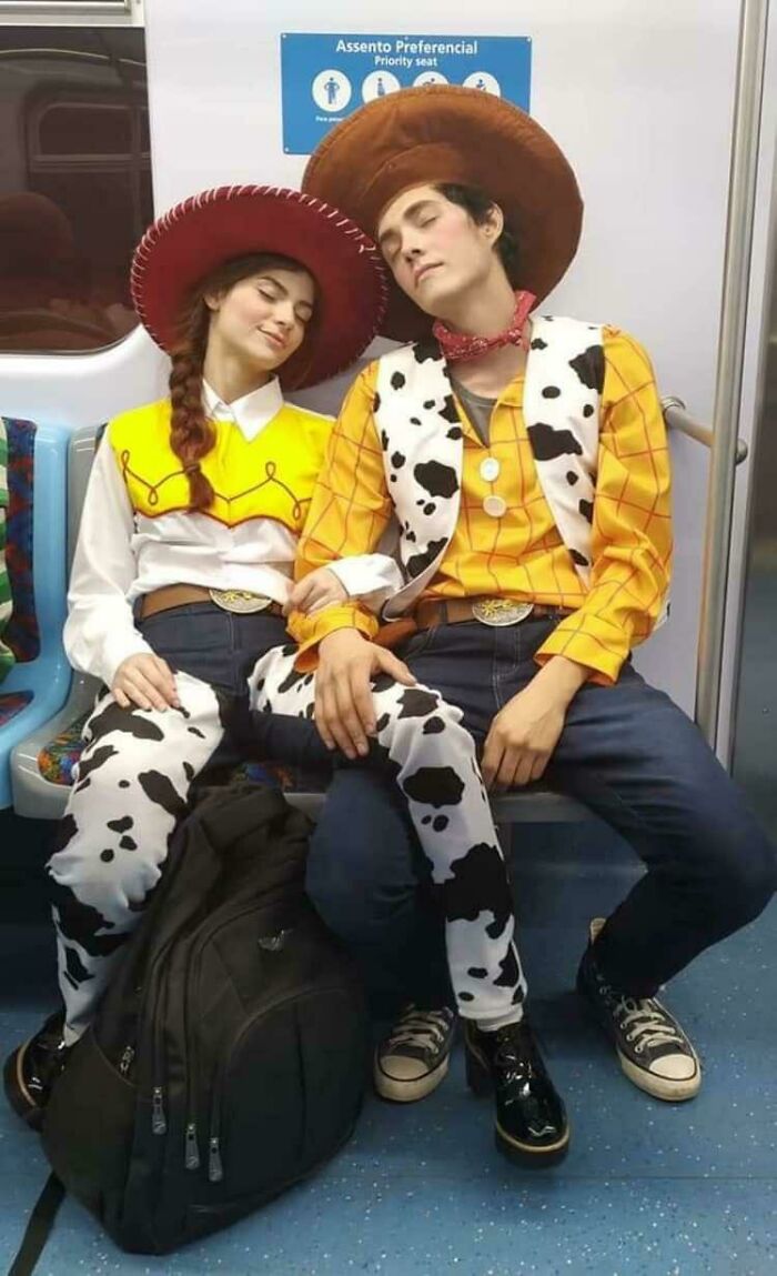 Funny subway passengers dressed in cowboy outfits napping on the train.