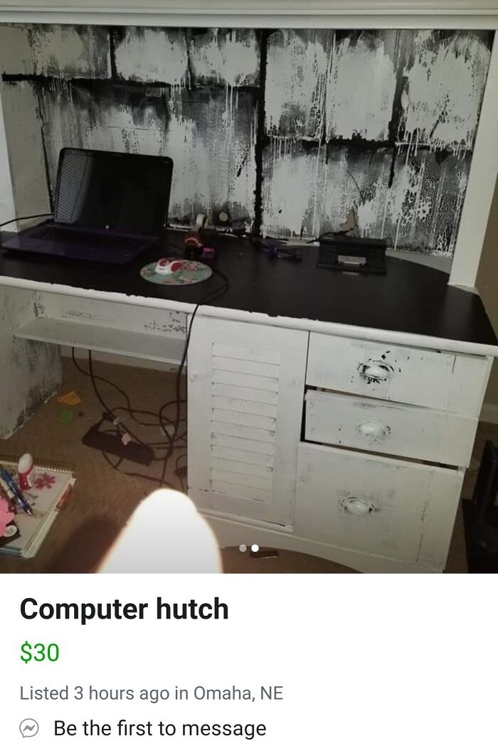 Creepy-looking computer hutch with black and white paint, selling online for $30.