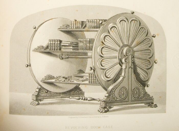 Revolving bookcase invention featuring ornate design and shelves with books.