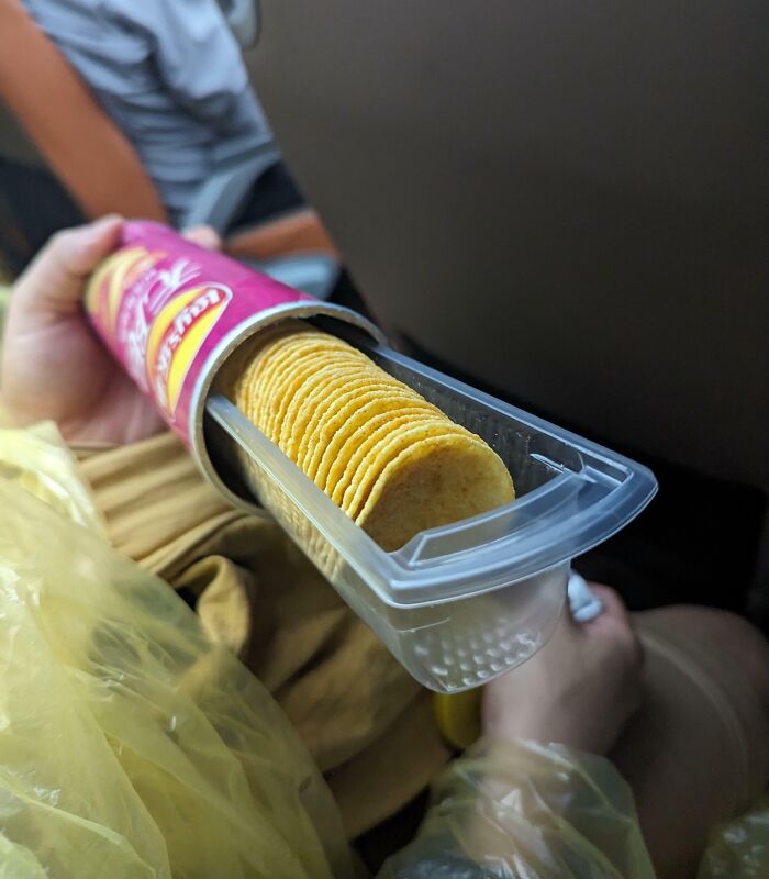 A Pringles can with an unexpected chip holder, a cool product surprise for easy access.