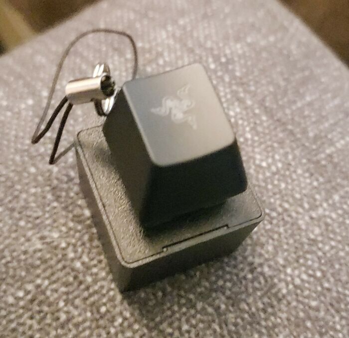 A cool gadget keychain resembling a keyboard key, showcasing unique design surprises.