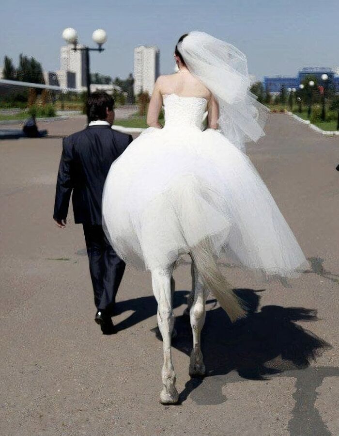 Bride walking with groom, dress creates confusing perspective with horse legs.