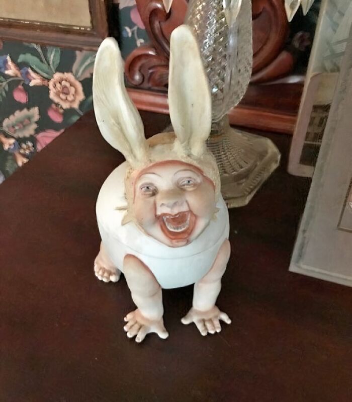 Bizarre figurine with a human face and rabbit ears, an example of creepy things sold online.