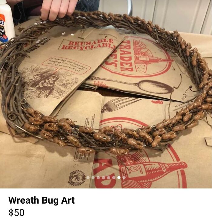 Handcrafted wreath made with cicada shells on a table, representing creepy things to sell online.