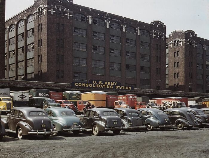 Vintage 1940s color photo of parked cars and trucks at U.S. Army Consolidating Station.