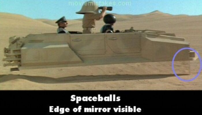 Scene from "Spaceballs" showing a mirror edge, illustrating funny movie mistakes in a desert setting.