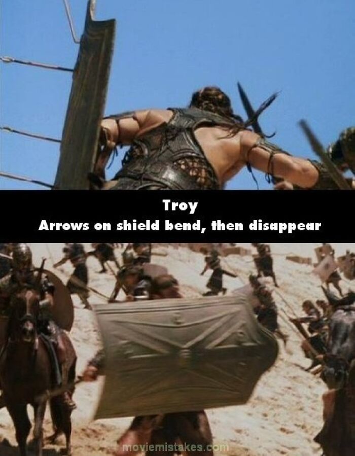 Warrior in "Troy" blocks arrows; funny movie mistakes seen as arrows bend and vanish.