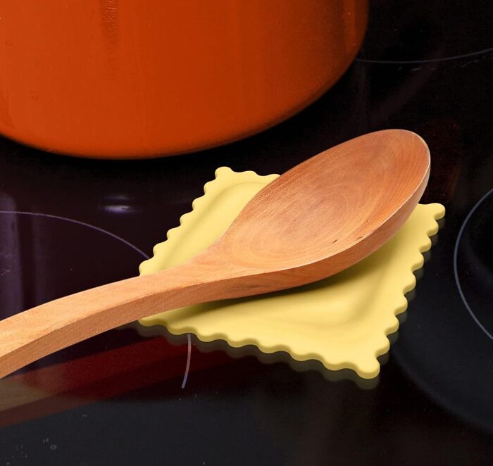 Wooden spoon resting on a ravioli-shaped spoon holder, a popular find for every home.