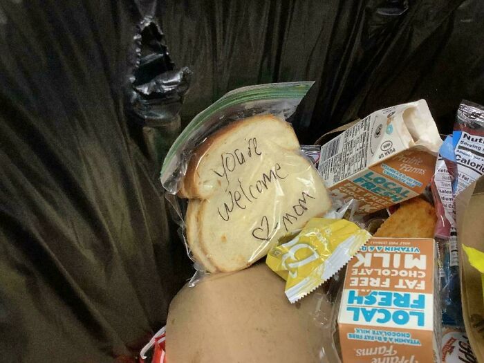 Bagged sandwich in trash with note, "You're welcome, mom," among discarded food items, illustrating people being jerks.