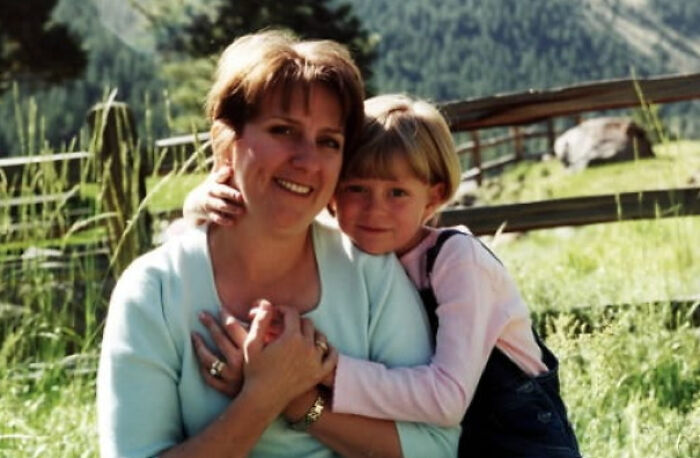 A woman and child hugging outdoors, related to true crime stories and curiosities.