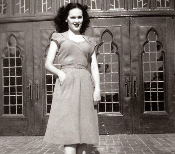 Woman standing in front of ornate doors, related to true crime stories and curiosities.