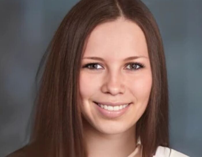 A woman smiling with long brown hair, featured in true crime stories content.