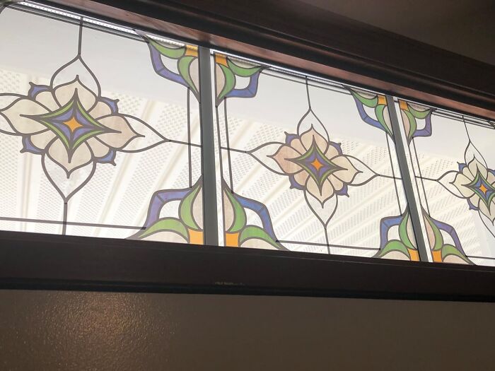 Stained glass window as renter friendly upgrade with geometric patterns in colorful design.