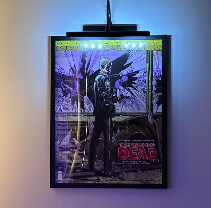 Framed comic book art with LED lighting, illustrating renter friendly upgrades on a wall.