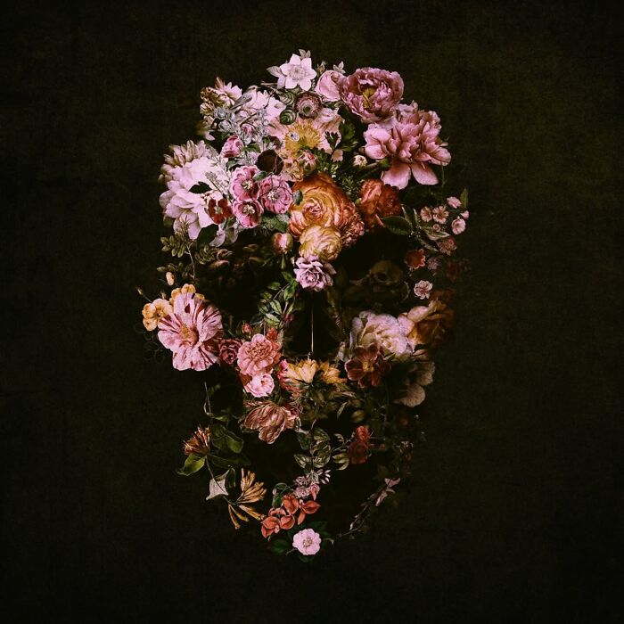 Floral skull artwork combining digital collage and photography on a dark background.