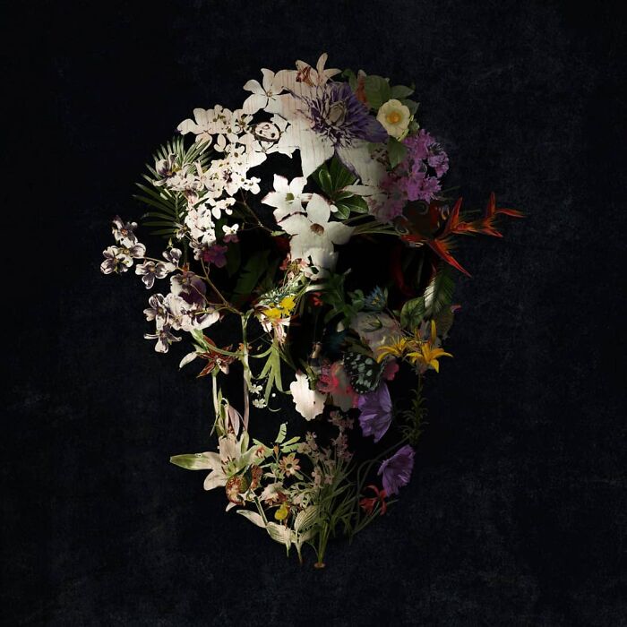 Floral skull artwork using digital and traditional collage techniques on a dark background.