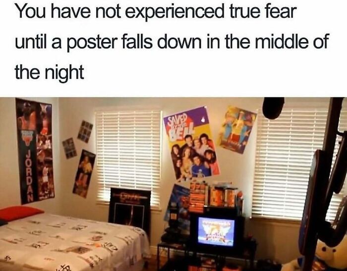 Nostalgic bedroom with 90s posters and a CRT TV, capturing a classic childhood fear of falling posters at night.