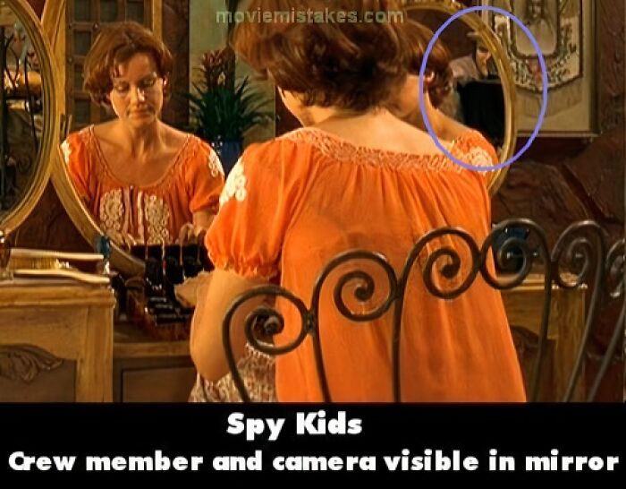 Crew and camera visible in mirror during a scene, showcasing funny movie mistakes.