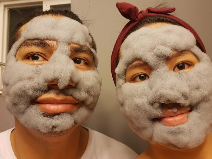 Two people wearing bubbling face masks, showcasing one of the weirdest gifts for hard-to-shop-for friends.