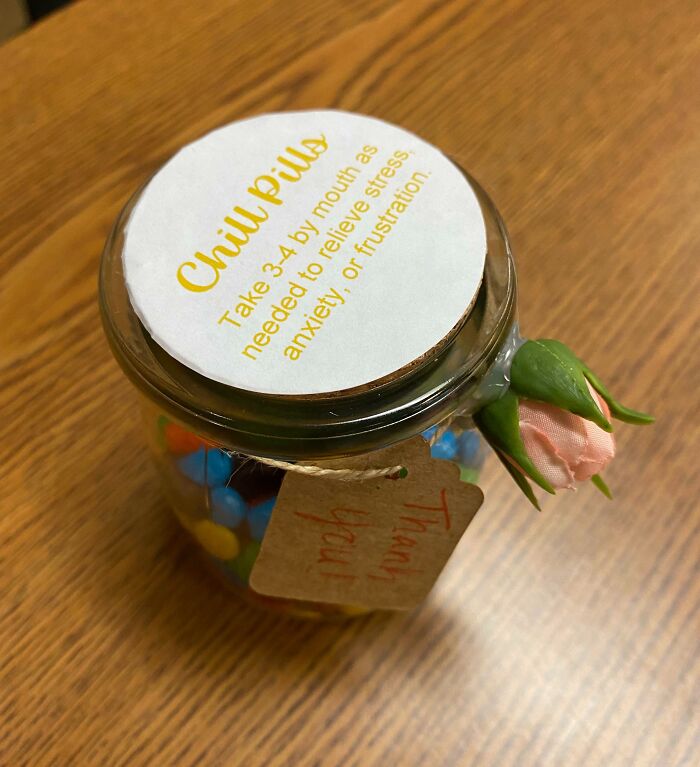 Jar of "Chill Pills" with a rose and a thank you tag, symbolizing infuriating company gifts.