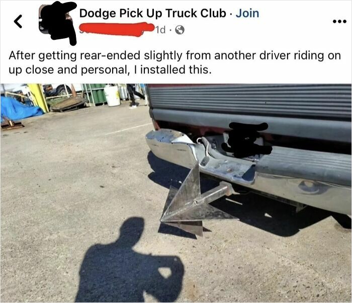 Truck bumper with a spiky metal contraption attached, showcasing a defensive modification.