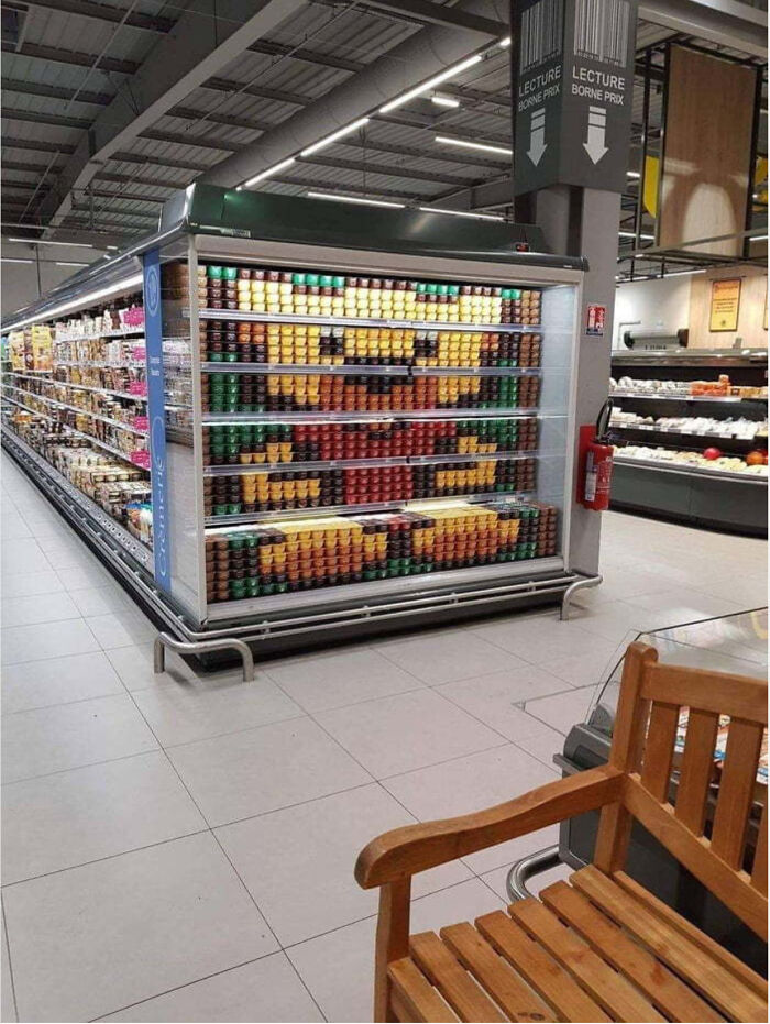 Neat results of next-level organization with colorful cans in a supermarket aisle.