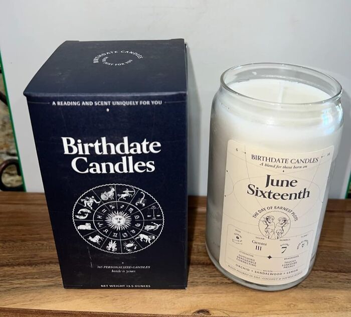 Birthdate candles on a wooden table, featuring astrology-themed packaging; perfect for Valentine's Day.