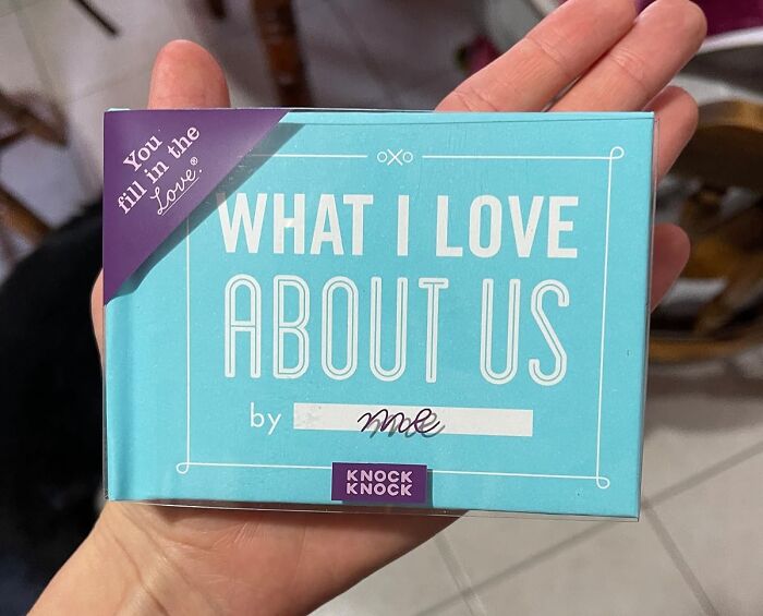 Valentines Day find: a small book titled "What I Love About Us," held in hand, with space to personalize by filling in.