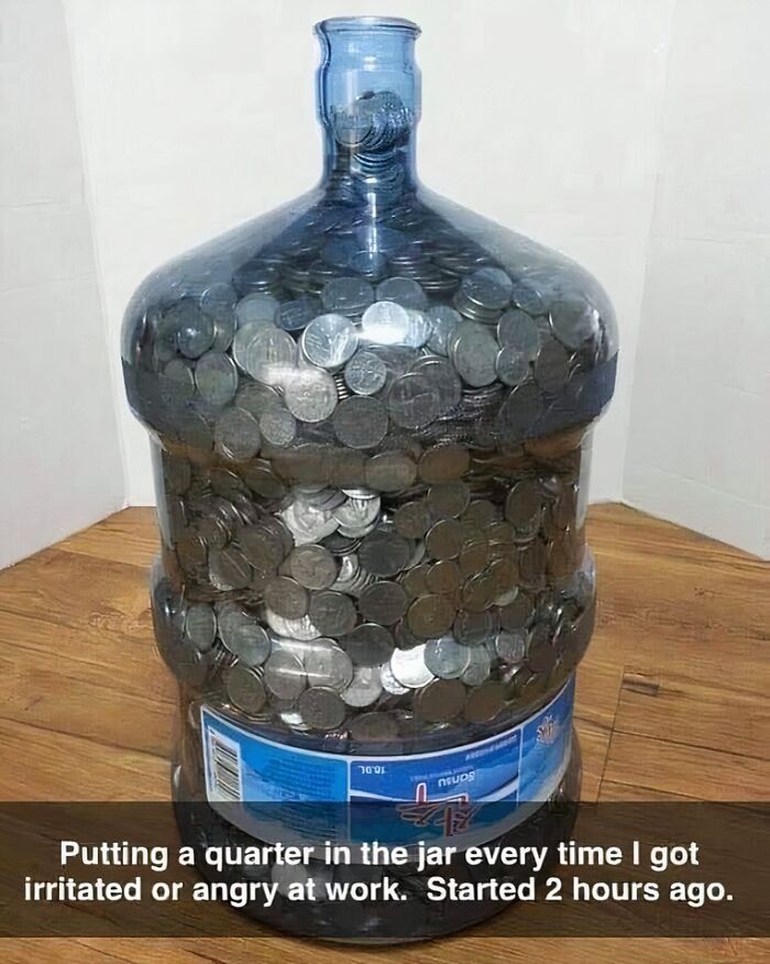 Large jar filled with quarters, a funny representation of office work frustrations.